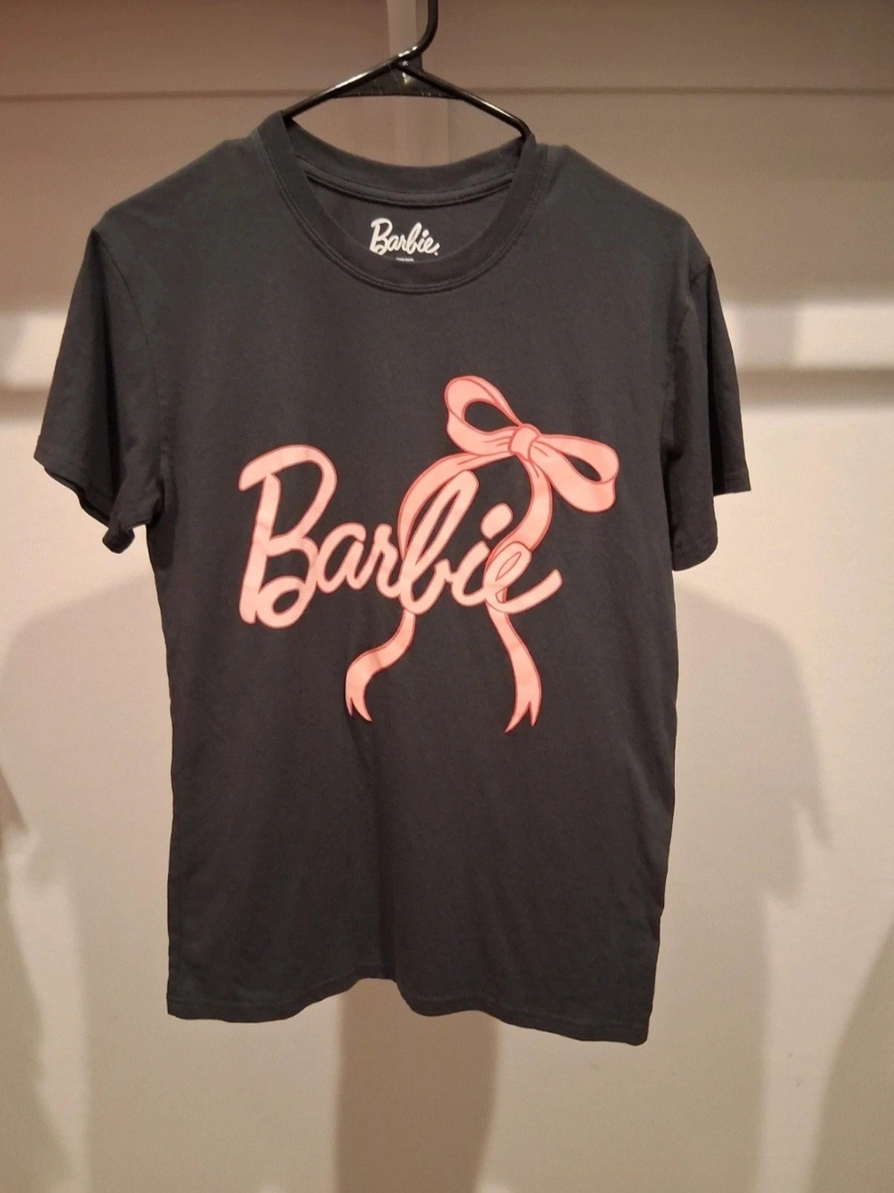 Barbie Black Tee with Pink Script and Bow Graphic